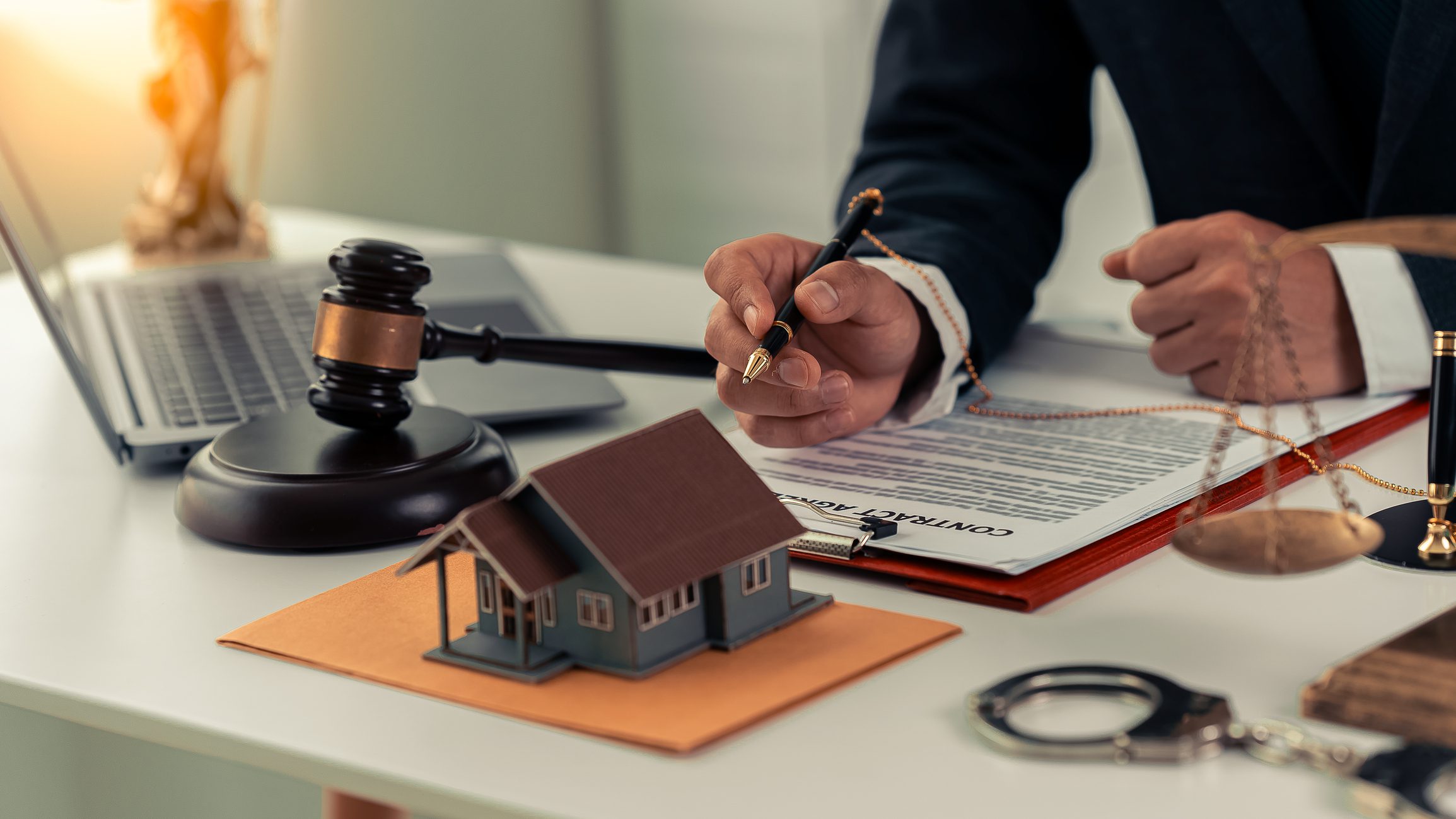 Legal documents and gavel on desk.