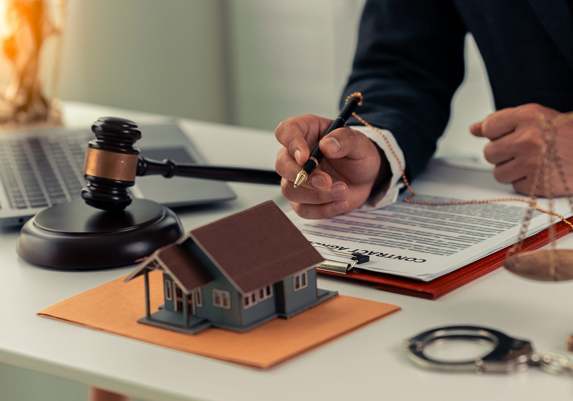 Legal documents and gavel on desk.